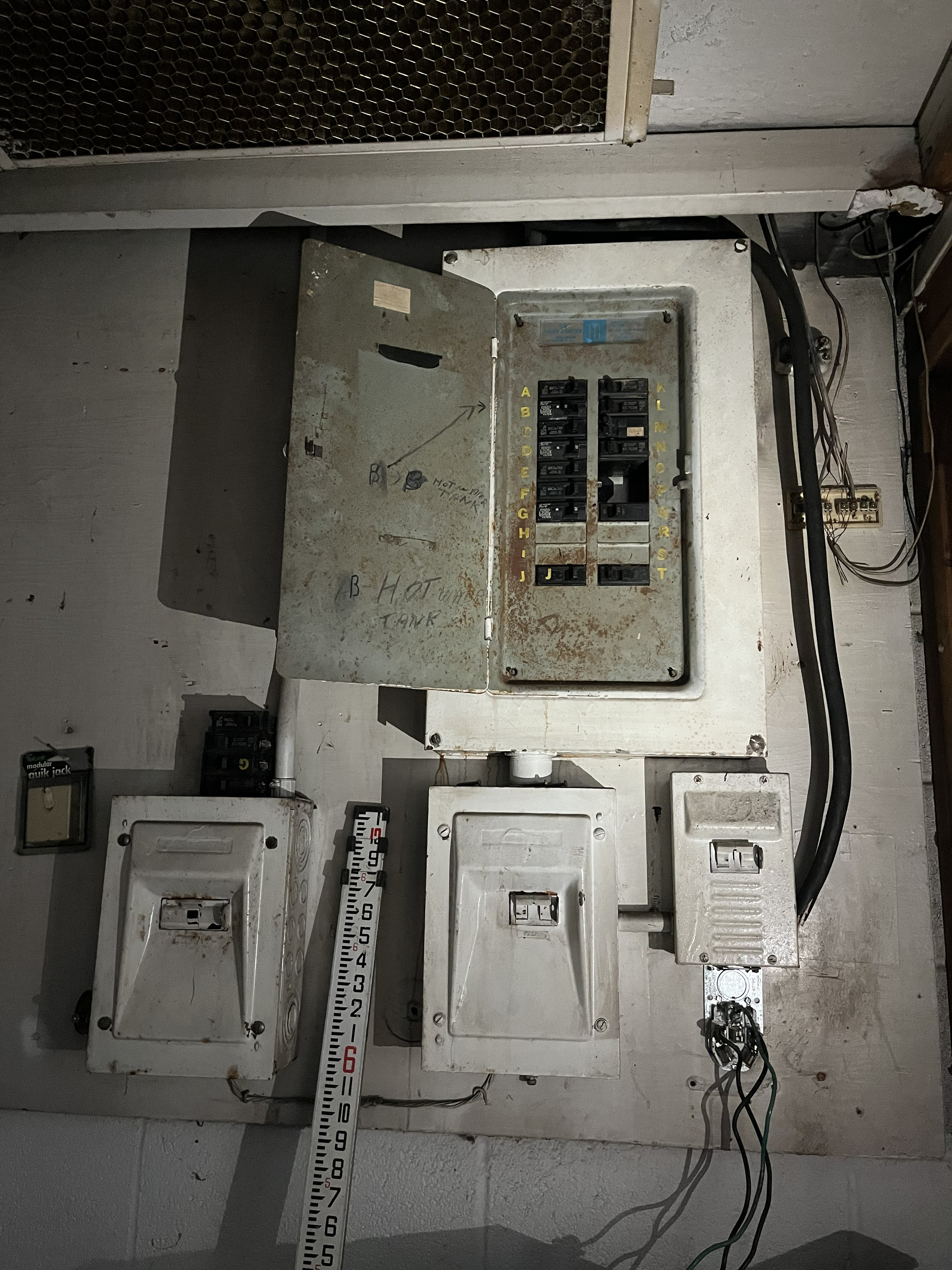 Old electrical panels before the service upgrade