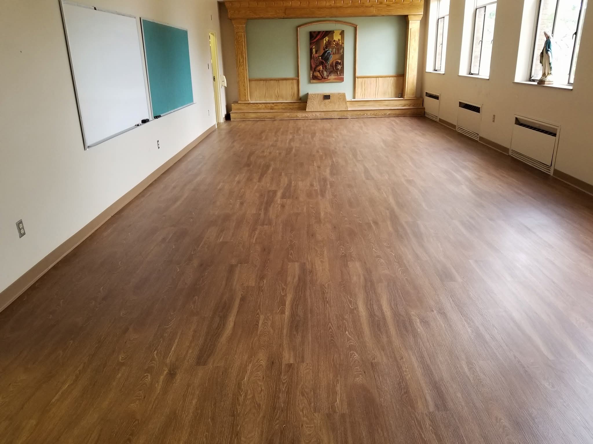 Large room after new wood-look flooring installation